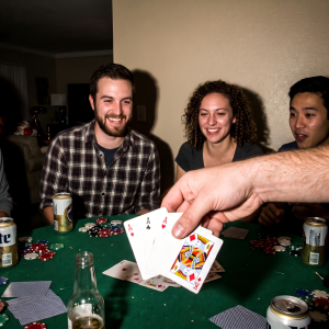 Friends Reacting During Exciting Poker Game Moment
