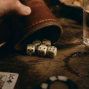 Playing Liars Dice With A Leather Cup And Five Dice